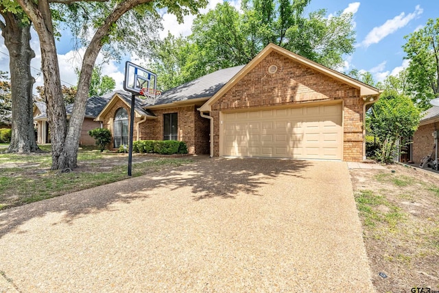 3110 Oleander Dr, Tyler, TX 75707 - view of front of property featuring concrete driveway, brick siding, and a garage