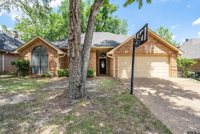 3110 Oleander Dr, Tyler, TX 75707 - ranch-style home with roof with shingles, concrete driveway, brick siding, and a garage