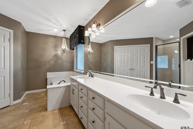 3110 Oleander Dr, Tyler, TX 75707 - full bathroom featuring a garden tub, visible vents, a stall shower, and a sink