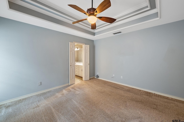 3110 Oleander Dr, Tyler, TX 75707 - empty room with a tray ceiling, a ceiling fan, visible vents, baseboards, and light colored carpet