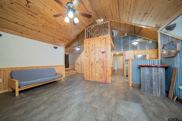 unfurnished room featuring beam ceiling, high vaulted ceiling, wood walls, and wood ceiling