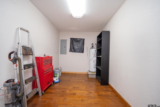 storage area featuring electric panel and water heater