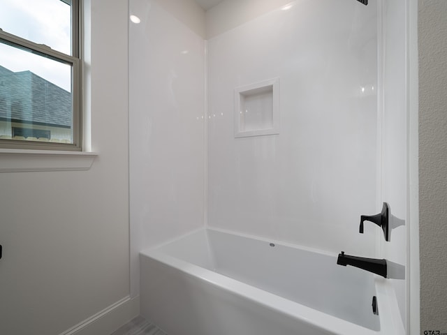 bathroom with shower / bathing tub combination