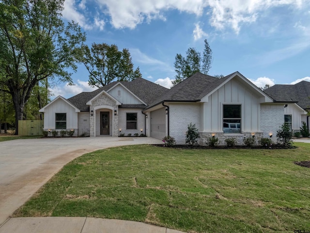 view of front of house with a front lawn and a garage