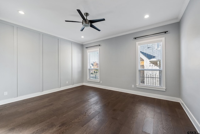 spare room with ceiling fan, crown molding, and dark wood-type flooring