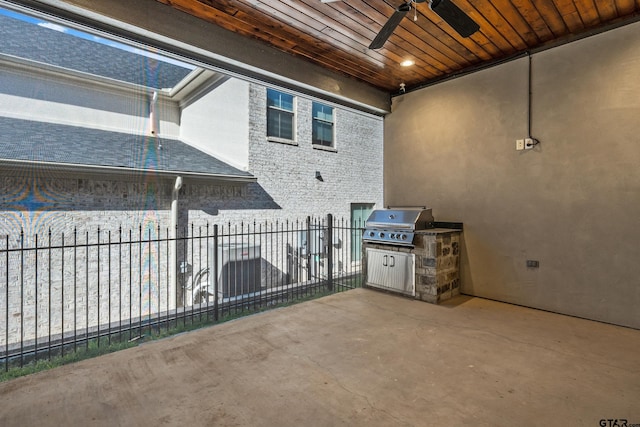 view of patio with ceiling fan and area for grilling