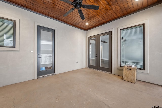 interior space featuring ceiling fan, french doors, and wood ceiling