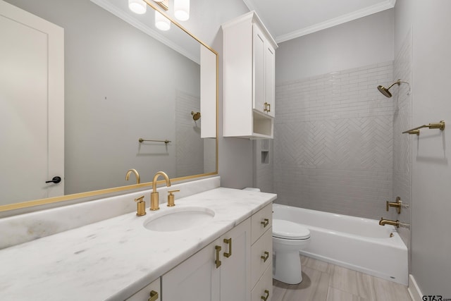 full bathroom featuring toilet, vanity, tiled shower / bath combo, and ornamental molding