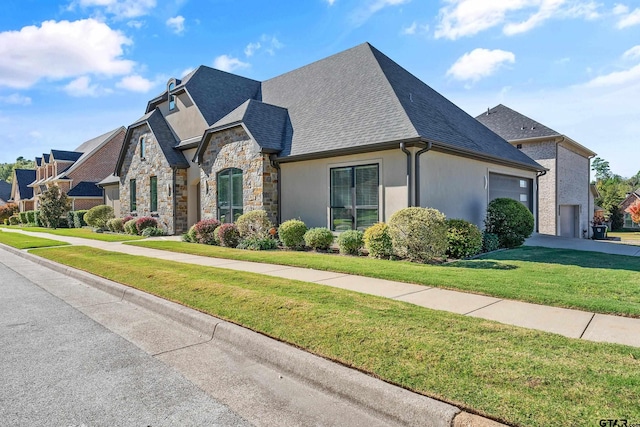 french country style house featuring a front lawn