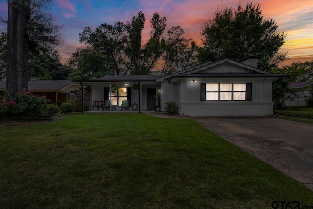 2631 Amy Ln, Tyler, TX 75701 - ranch-style house featuring a chimney, a yard, and a porch