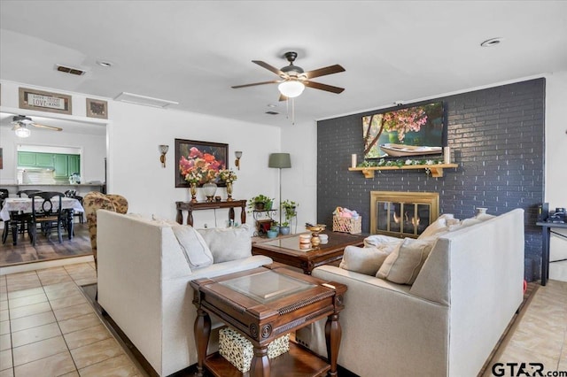 2631 Amy Ln, Tyler, TX 75701 - living room with a ceiling fan, light tile patterned floors, and a fireplace