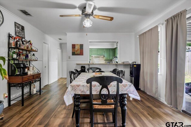 2631 Amy Ln, Tyler, TX 75701 - dining room with ceiling fan, wood finished floors, and crown molding