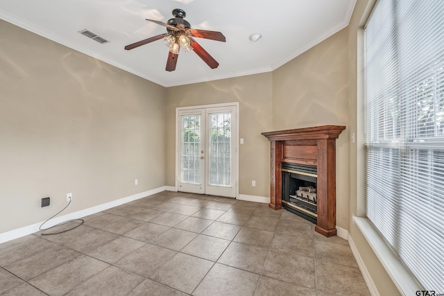unfurnished living room with light tile patterned floors, a ceiling fan, visible vents, ornamental molding, and french doors