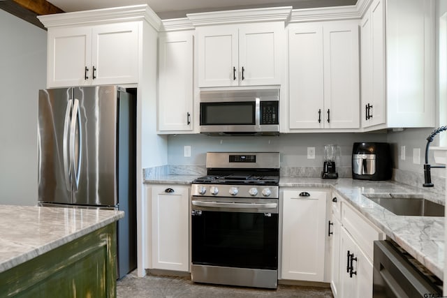 1605 County Road 4510, Winnsboro, TX 75494 - kitchen with appliances with stainless steel finishes, a sink, and white cabinetry