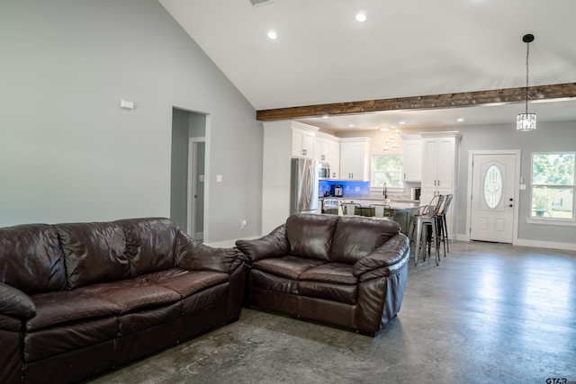 1605 County Road 4510, Winnsboro, TX 75494 - living room with recessed lighting, plenty of natural light, finished concrete floors, baseboards, and high vaulted ceiling