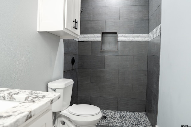 1605 County Road 4510, Winnsboro, TX 75494 - bathroom featuring toilet, a tile shower, and vanity