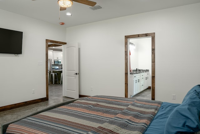 1605 County Road 4510, Winnsboro, TX 75494 - bedroom with finished concrete flooring, baseboards, and ceiling fan
