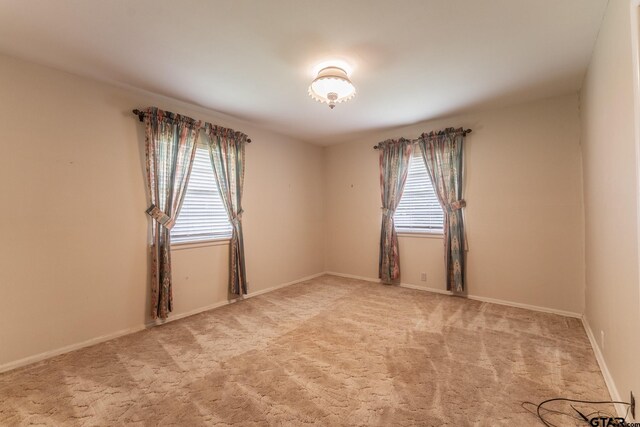 138 Drexel Dr, Sulphur Springs, TX 75482 - spare room with light colored carpet and baseboards