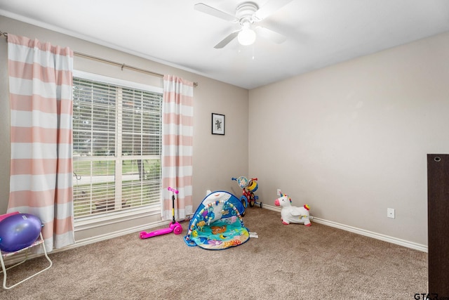 rec room featuring ceiling fan and carpet floors