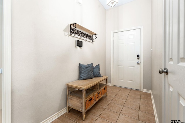 entryway with light tile patterned flooring