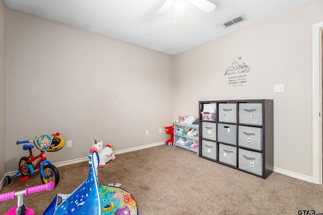 recreation room with carpet and ceiling fan