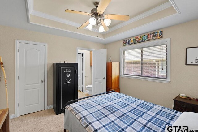 3029 Yasmeen Cir, Flint, TX 75762 - bedroom with a tray ceiling, light carpet, crown molding, ceiling fan, and ensuite bath