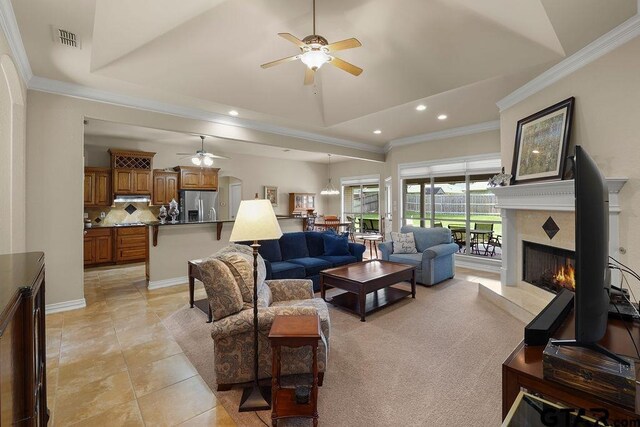 3029 Yasmeen Cir, Flint, TX 75762 - living room with a ceiling fan, a high end fireplace, recessed lighting, ornamental molding, and light tile patterned floors