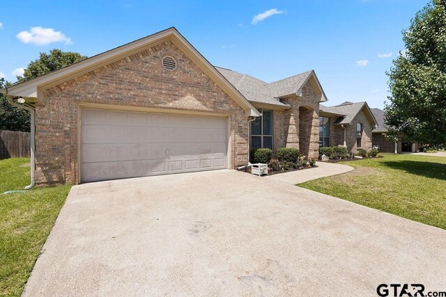 3029 Yasmeen Cir, Flint, TX 75762 - view of front of property featuring brick siding, driveway, a garage, and roof with shingles