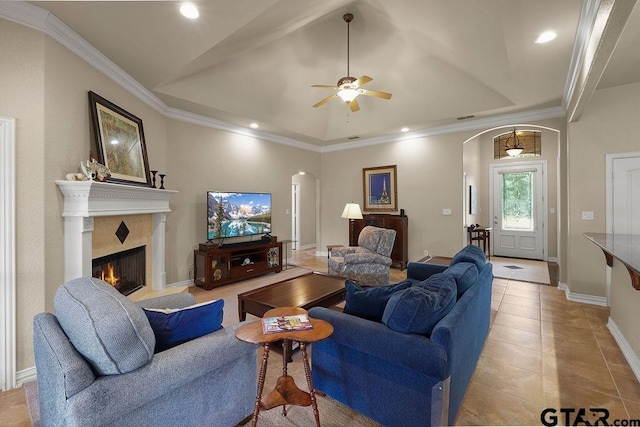 3029 Yasmeen Cir, Flint, TX 75762 - living room with arched walkways, a ceiling fan, a high end fireplace, vaulted ceiling, and light tile patterned flooring