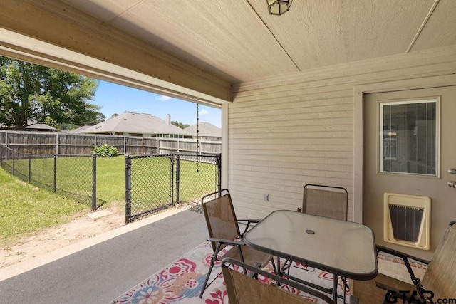 3029 Yasmeen Cir, Flint, TX 75762 - view of patio with outdoor dining area, heating unit, and a gate