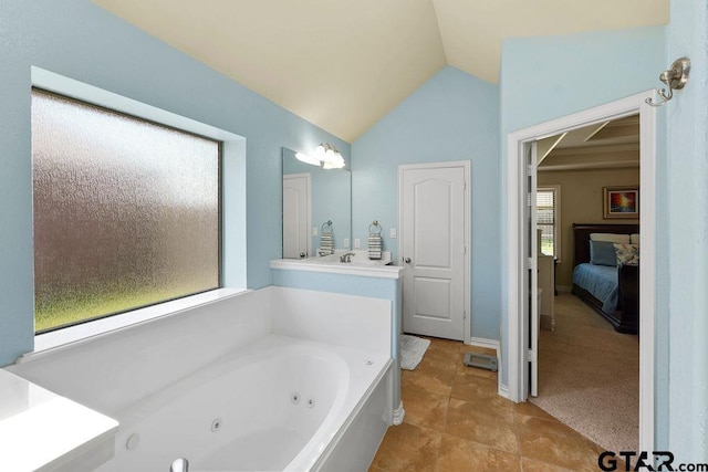 3029 Yasmeen Cir, Flint, TX 75762 - ensuite bathroom with a whirlpool tub, lofted ceiling, tile patterned flooring, and baseboards