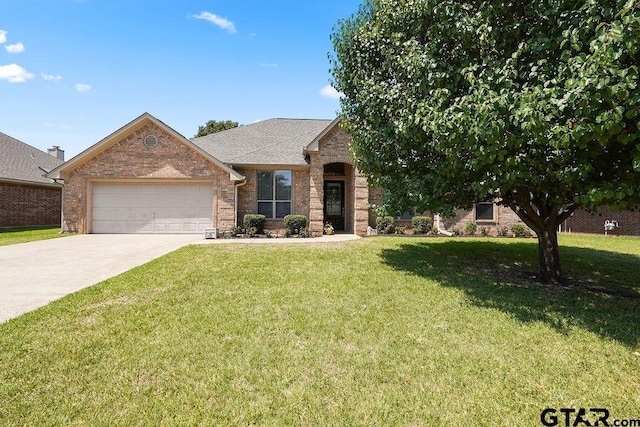 3029 Yasmeen Cir, Flint, TX 75762 - view of front of home featuring an attached garage, brick siding, a front lawn, and concrete driveway