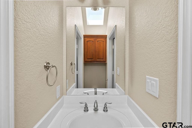 3029 Yasmeen Cir, Flint, TX 75762 - bathroom with a textured wall and vanity
