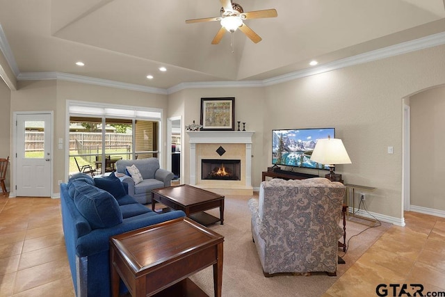 3029 Yasmeen Cir, Flint, TX 75762 - living area featuring a warm lit fireplace, crown molding, ceiling fan, recessed lighting, and arched walkways