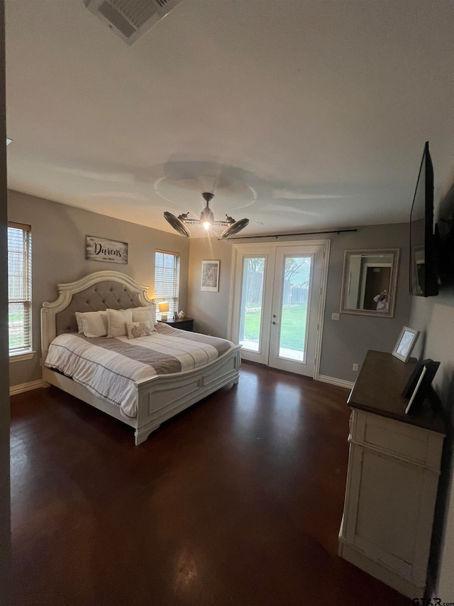 bedroom with access to exterior, multiple windows, and ceiling fan