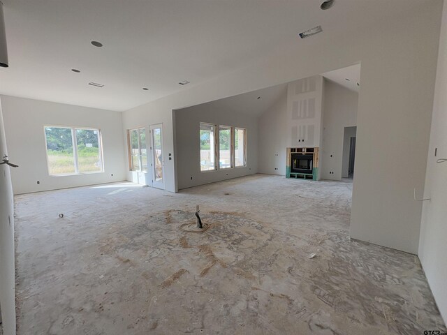 8532 Freestone Dr, Bullard, TX 75757 - unfurnished living room with healthy amount of natural light and vaulted ceiling