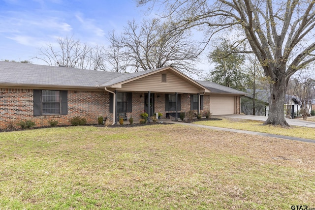 ranch-style home featuring a front yard, covered porch, and a garage