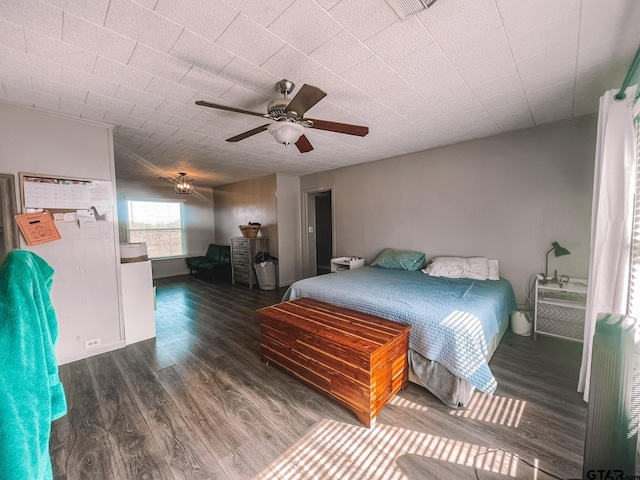 bedroom featuring ceiling fan and dark hardwood / wood-style floors