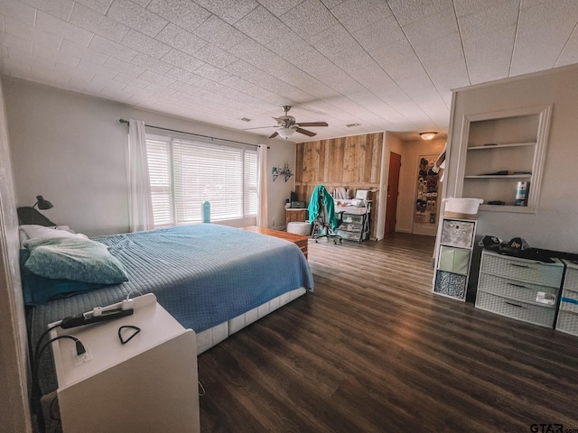 bedroom featuring dark hardwood / wood-style flooring and ceiling fan