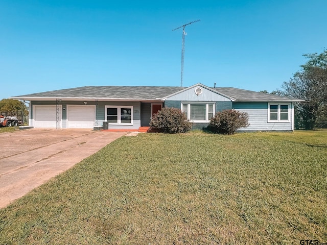 single story home featuring a garage and a front lawn