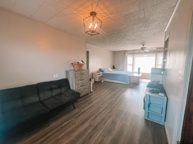 bedroom with dark hardwood / wood-style flooring