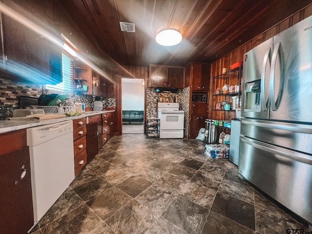 kitchen with wood ceiling, wooden walls, sink, tasteful backsplash, and appliances with stainless steel finishes