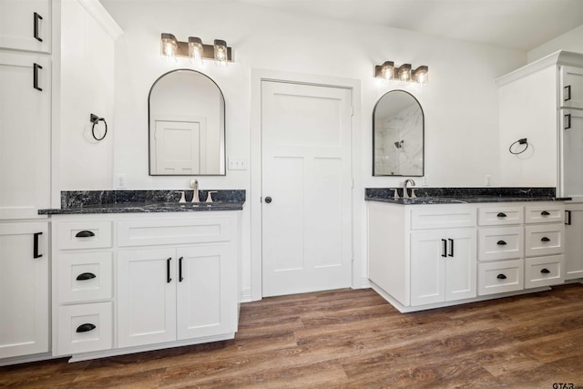 bathroom featuring vanity and wood-type flooring