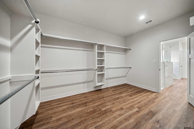 walk in closet featuring hardwood / wood-style flooring