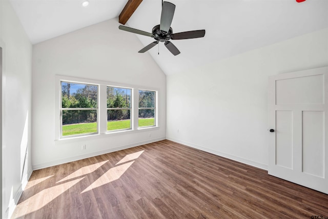 empty room featuring hardwood / wood-style floors, lofted ceiling with beams, and ceiling fan