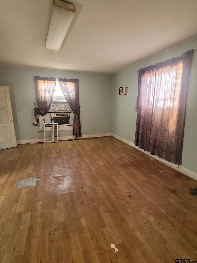 unfurnished living room with hardwood / wood-style flooring