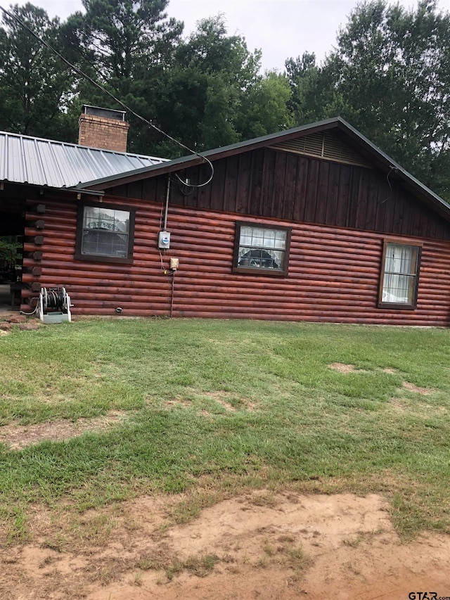 view of home's exterior featuring a lawn