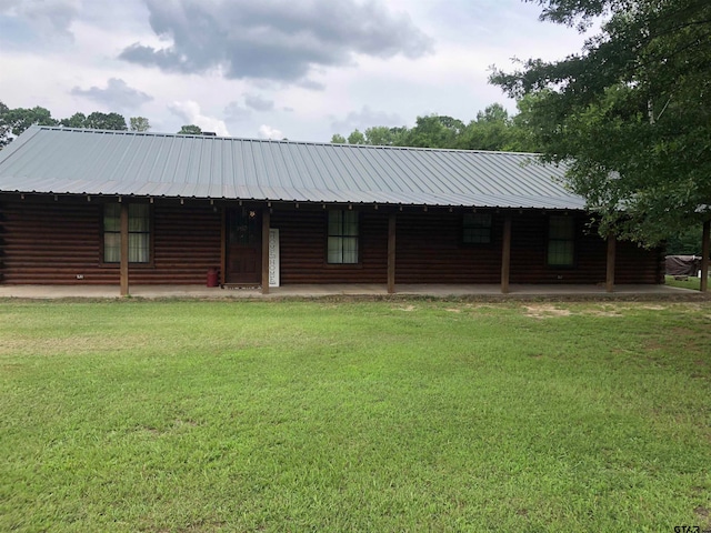 log cabin with a front yard