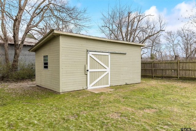 view of shed with fence