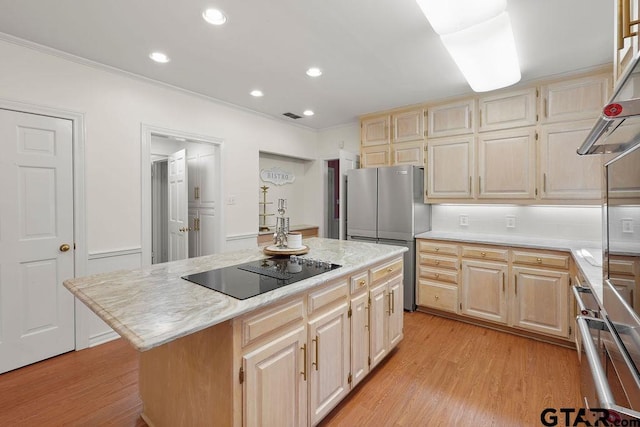 1701 Devonshire Dr, Tyler, TX 75703 - kitchen featuring stainless steel appliances, light countertops, light wood-style floors, crown molding, and a kitchen island